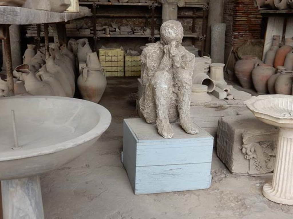 VII.7.29 Pompeii. May 2015. Basins, pots, amphorae, capital, and plaster cast in storage. Photo courtesy of Buzz Ferebee.

