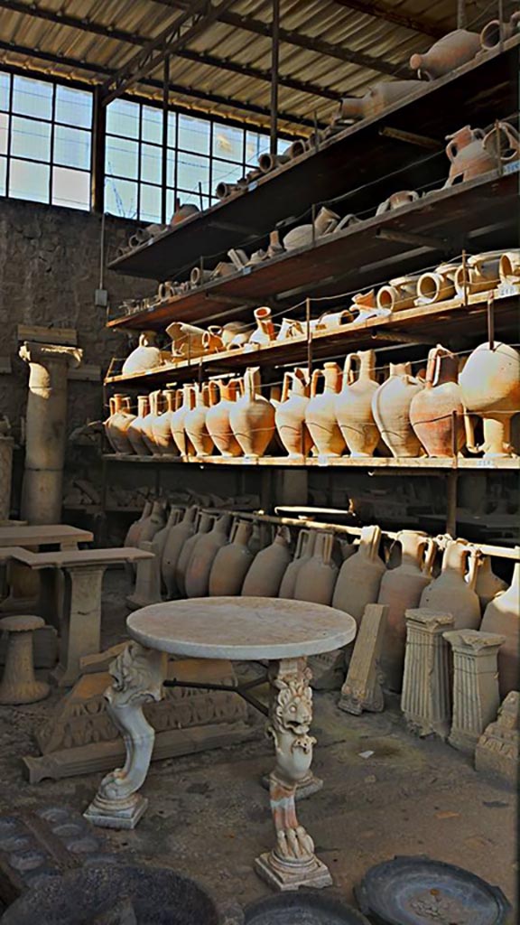 VII.7.29 Pompeii. 2016/2017. 
Tables and amphorae in storage. Photo courtesy of Giuseppe Ciaramella.
