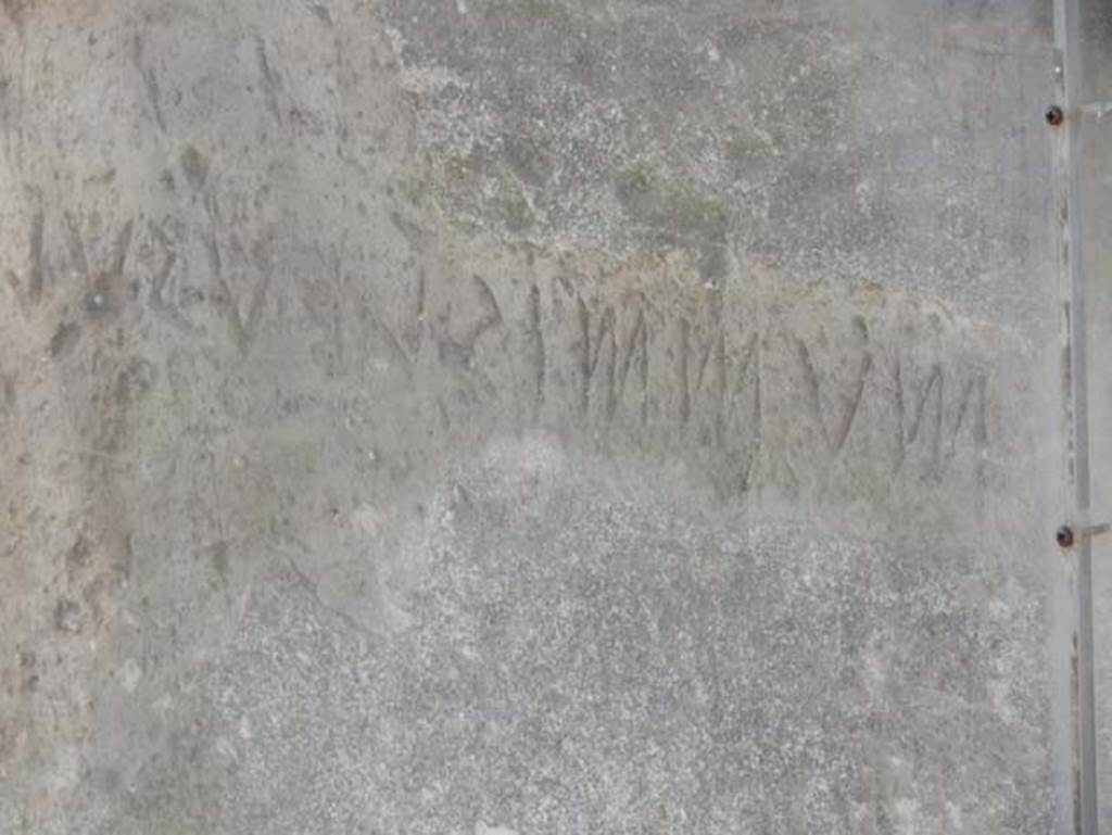 VII.7.32 Pompeii. December 2019. Inscription in south-west corner of Temple. Photo courtesy of Giuseppe Ciaramella.