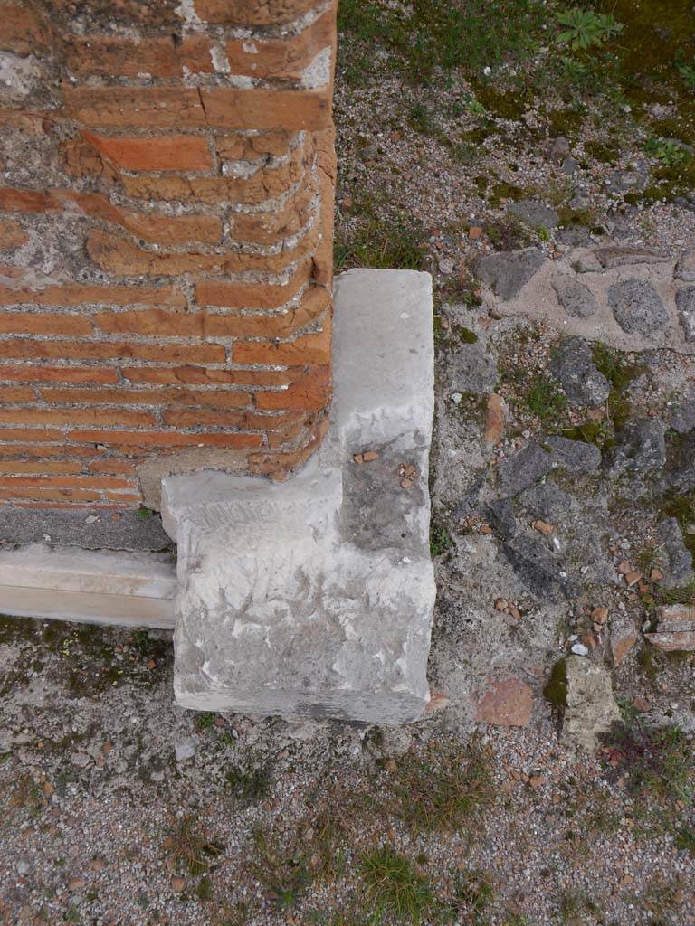 VII.9.2 Pompeii. March 2019. Detail of base on north side of doorway to cella. 
Foto Anne Kleineberg, ERC Grant 681269 DÉCOR.
