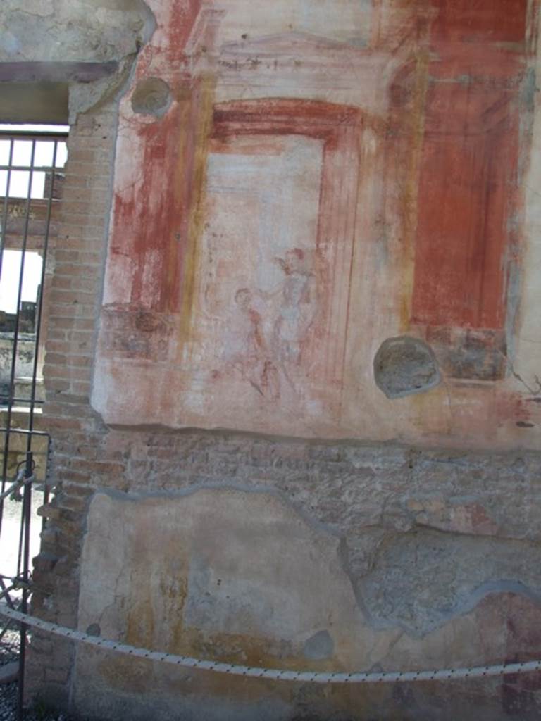 VII.9.7 and VII.9.8 Pompeii. Macellum. March 2009. 
North-west corner, west wall, north side of doorway. Wall painting of Victory crowning a warrior?
