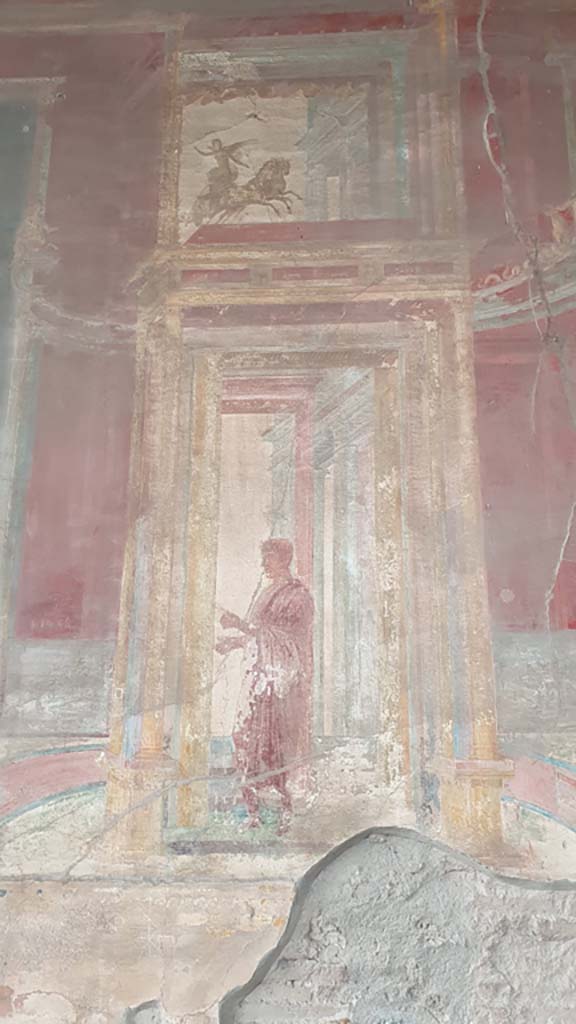 VII.9.7/8 Pompeii. August 2021. 
Painted panel with figure from north side of central painting on west wall.
Foto Annette Haug, ERC Grant 681269 DÉCOR.

