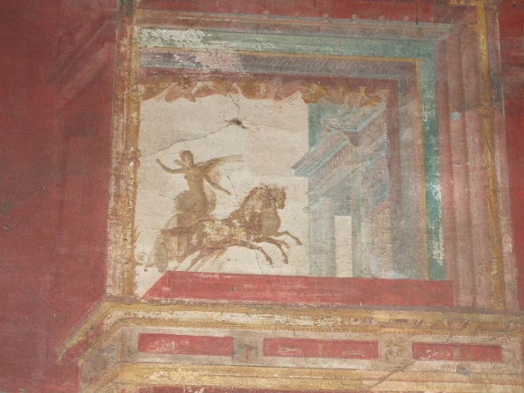 VII.9.7 and VII.9.8 Pompeii. Macellum. September 2005. North west corner. Painting of winged figure (Victory?) in chariot.