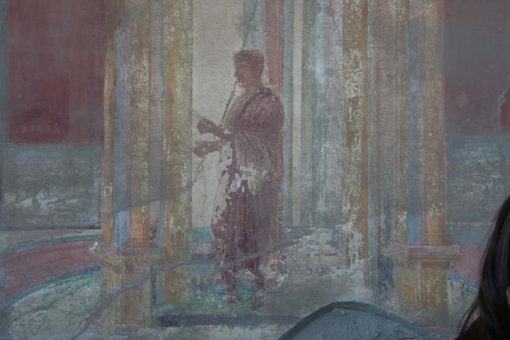 VII.9.7 and VII.9.8 Pompeii. Macellum. April 2013. Painted figure of man wearing a toga, from west wall in north-west corner.
Photo courtesy of Klaus Heese.
