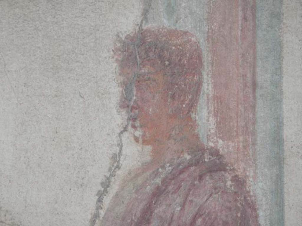 VII.9.7 and VII.9.8 Pompeii. Macellum. May 2015.  North-west corner, detail of painting of figure in toga. Photo courtesy of Buzz Ferebee.
