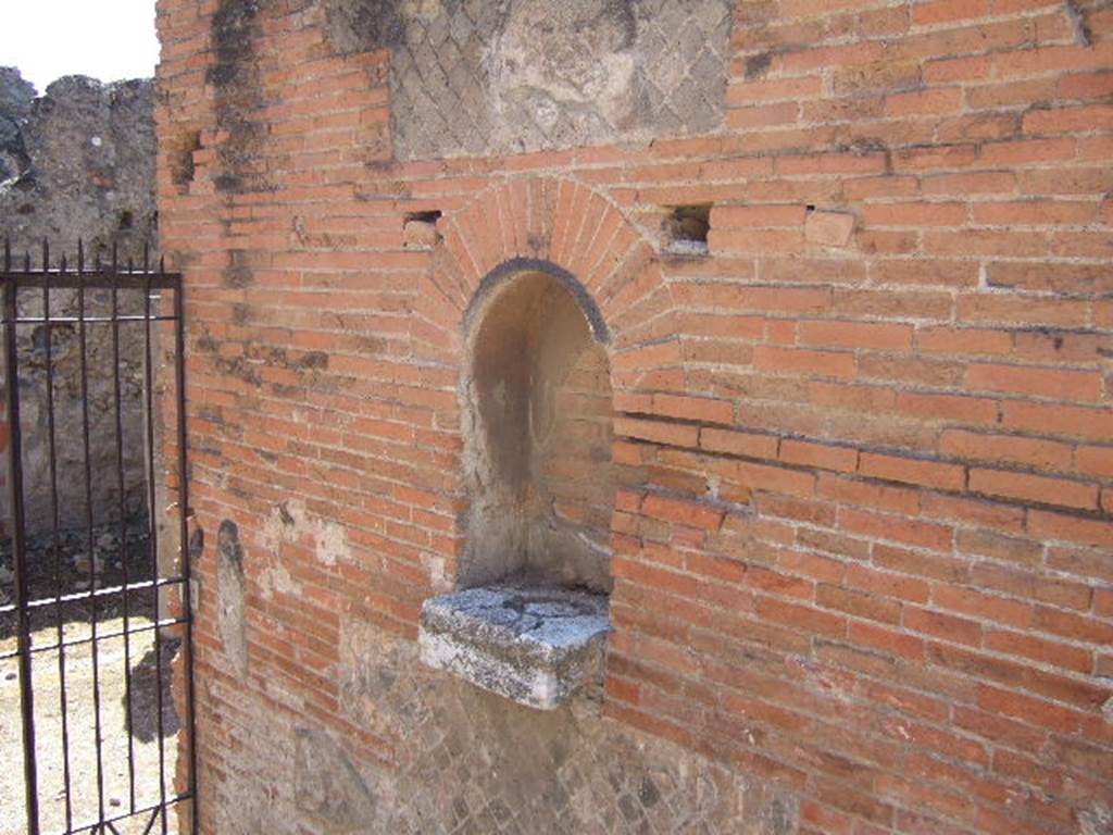 VII.9.42 Pompeii. March 2009. West wall. Arched niche of Street altar.