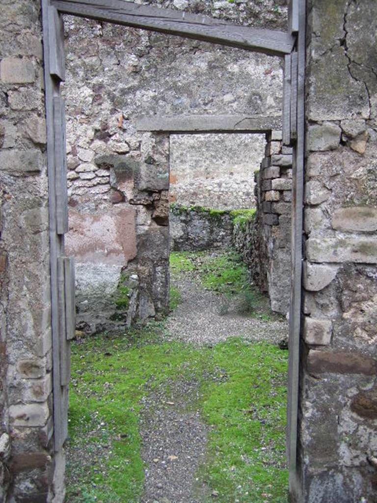 VII.9.43 Pompeii. December 2005. Looking south through doorway into room, the room below is on the left.