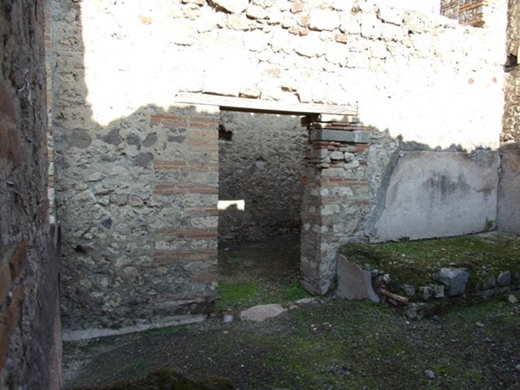 VII.11.5 Pompeii. December 2007. North wall with door to corridor and latrine.