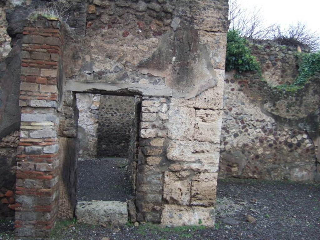 VII.13.8 Pompeii. December 2005. Doorway to room in north west corner of atrium. 
Looking north.