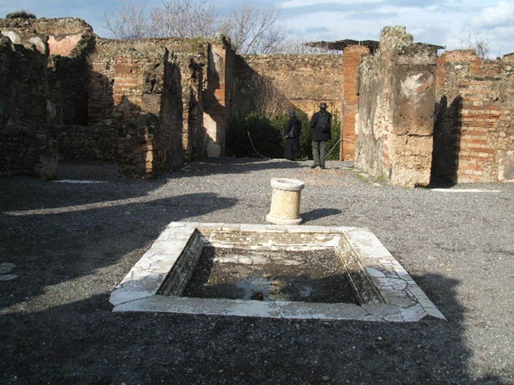 VII.14.9 Pompeii. December 2004. Room 1, looking north across impluvium in atrium. 