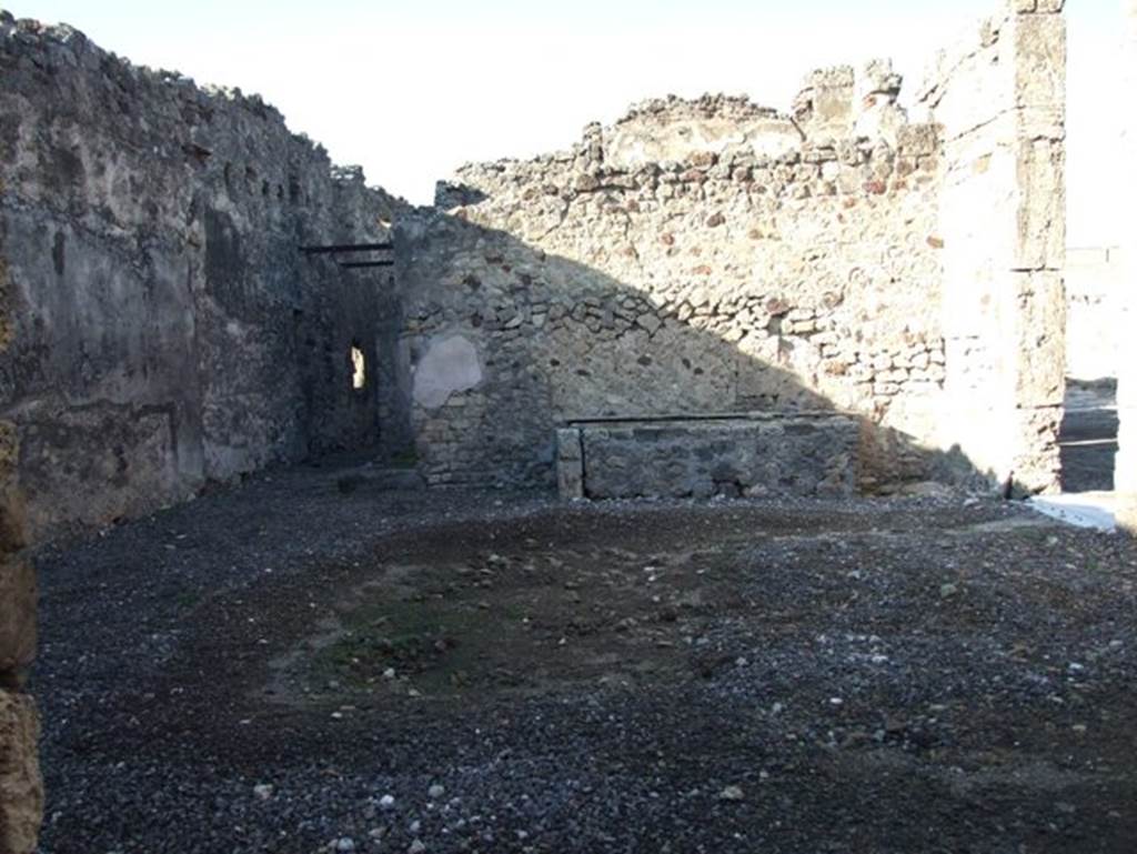 VII.15.1 Pompeii.  December 2007.  Atrium looking north to corridor leading to rear of house and latrine.  A masonry platform base is on the north wall.