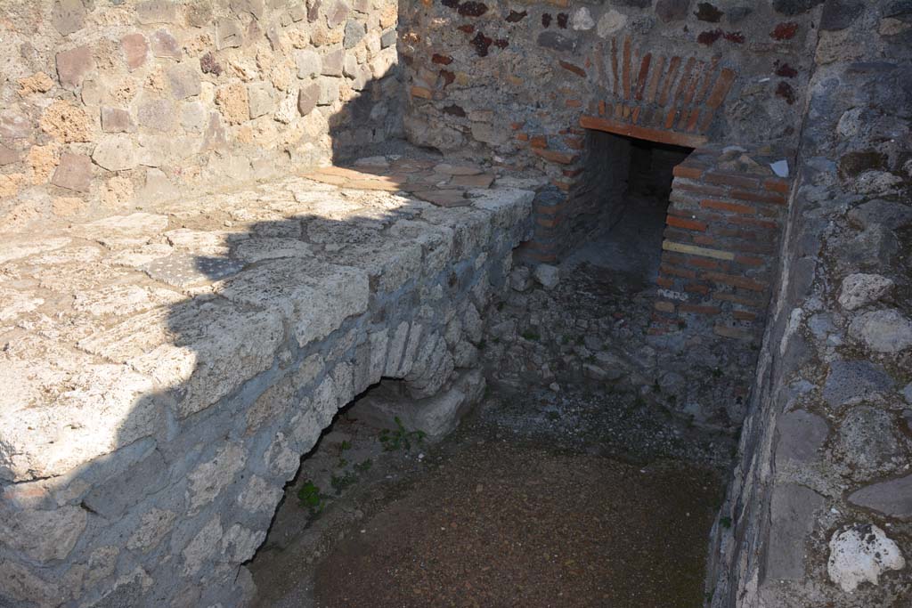 VII.15.2 Pompeii. October 2019. Hearth against north wall in kitchen, looking east.
Foto Annette Haug, ERC Grant 681269 DCOR.
