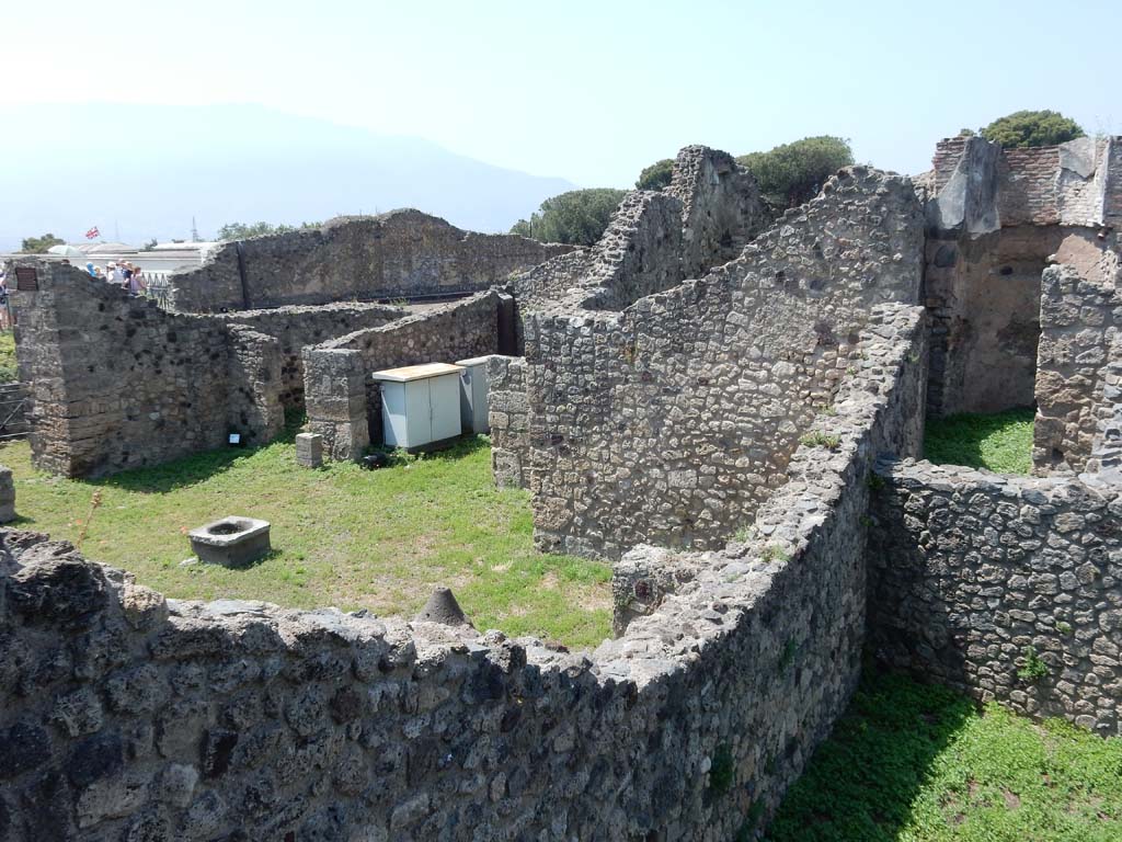 VII.16.1 Pompeii. June 2019.  Looking south-west (from VII.16.10) across wall of tablinum, on north side of atrium. 
Photo courtesy of Buzz Ferebee.
