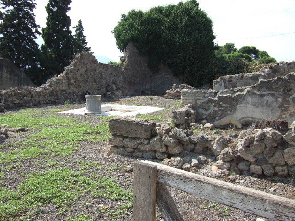 VII.16.10 Pompeii. September 2005. Looking south-west across atrium from VII.16.11. According to Boyce, in a room to the south side of the house was a square niche. Its inside walls were coated with white stucco, “forse per uso di sanctuario o edicolo”, according to the report. He gave the reference PAH, ii, 494, (Feb. 27, 1851).  See Boyce G. K., 1937. Corpus of the Lararia of Pompeii. Rome: MAAR 14. (p.73, no.338)
See Fiorelli G., 1862. Pompeianarum antiquitatum historia, Vol. 2: 1819 - 1860, Naples, p. 494, (Feb. 27, 1851).
