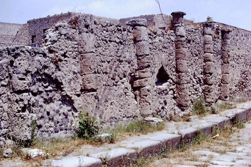 South perimeter wall of VII.16.17 with half columns, Pompeii. 1973. Vicolo dei Soprastanti, looking east.  Photo by Stanley A. Jashemski. 
Source: The Wilhelmina and Stanley A. Jashemski archive in the University of Maryland Library, Special Collections (See collection page) and made available under the Creative Commons Attribution-Non Commercial License v.4. See Licence and use details. J73f0195

