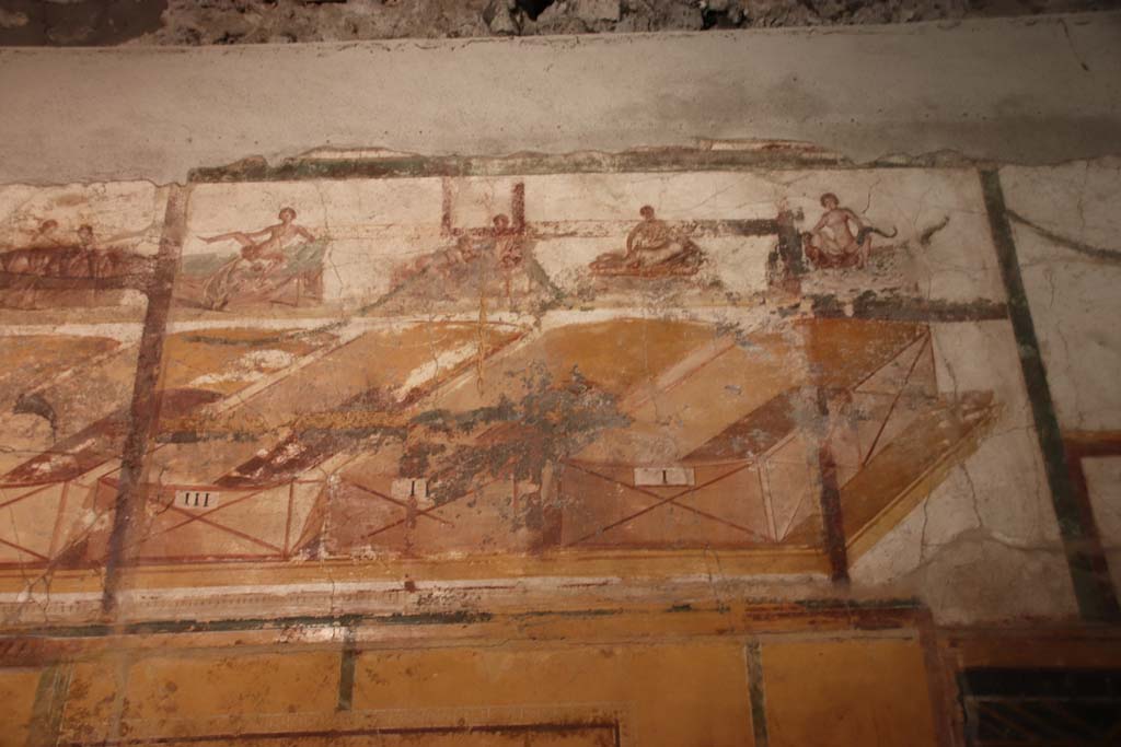 VII.16.a Pompeii. October 2020. Room 7, erotic paintings on upper south wall, numbered III, II, and I. Photo courtesy of Klaus Heese.