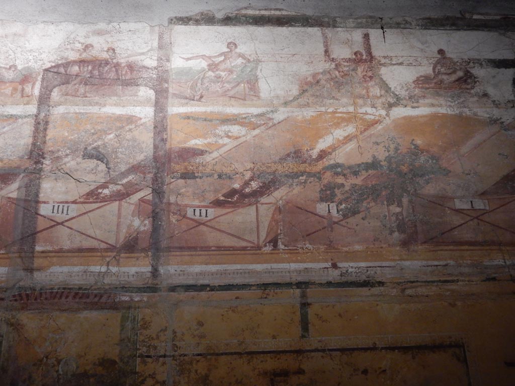 VII.16.a Pompeii. May 2015. 
Room 7, south wall, erotic paintings with numbers IIII, III, II and I beneath. Photo courtesy of Buzz Ferebee.
