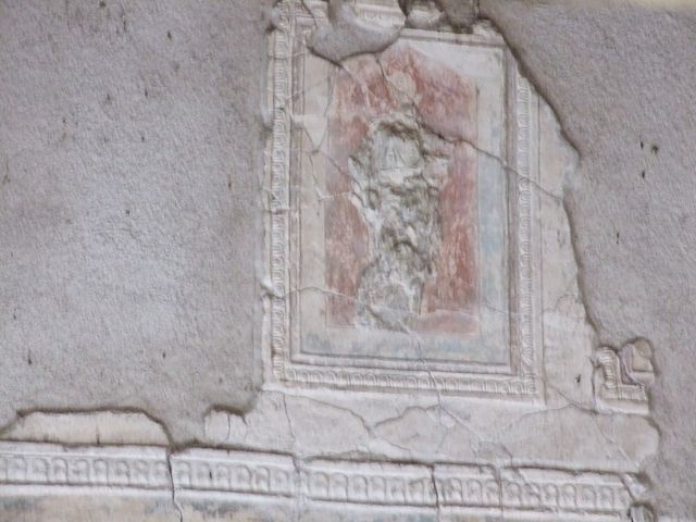 VII.16.a Pompeii. October 2020. Room 1, upper west wall, detail of plasterwork and painting on the west wall. 
Photo courtesy of Klaus Heese.
