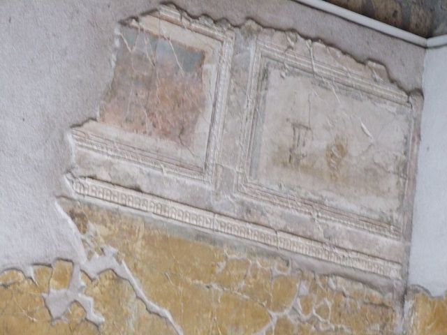 VII.16.a Pompeii. December 2006. Room 1, plasterwork and painting on the west wall.