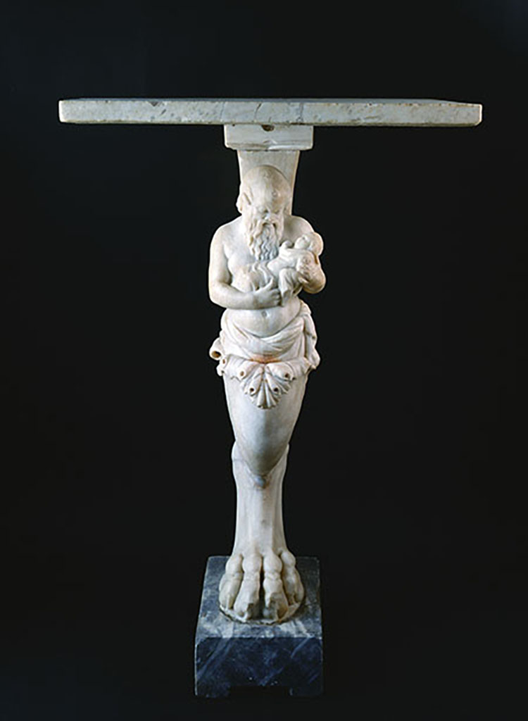 VIII.1.4 Pompeii Antiquarium. Monopodium table with Silenus holding the child Bacchus in his arms.