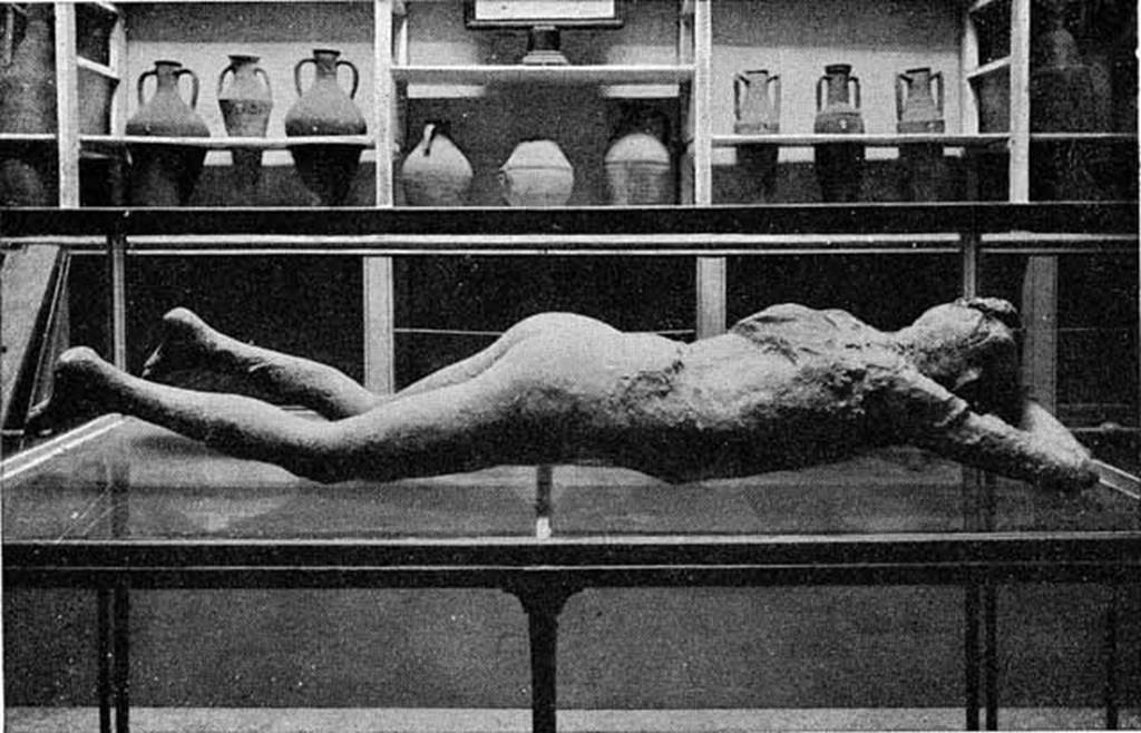VIII.1.4 Pompeii Antiquarium. About 1892. Cast of woman (Victim number 10) found on Via Stabiana. 
See Dwyer, E., 2010. Pompeiis Living Statues. Ann Arbor: University of Michigan Press.
Behind are shelves with clay amphorae and jars. Photo courtesy of Rick Bauer.
