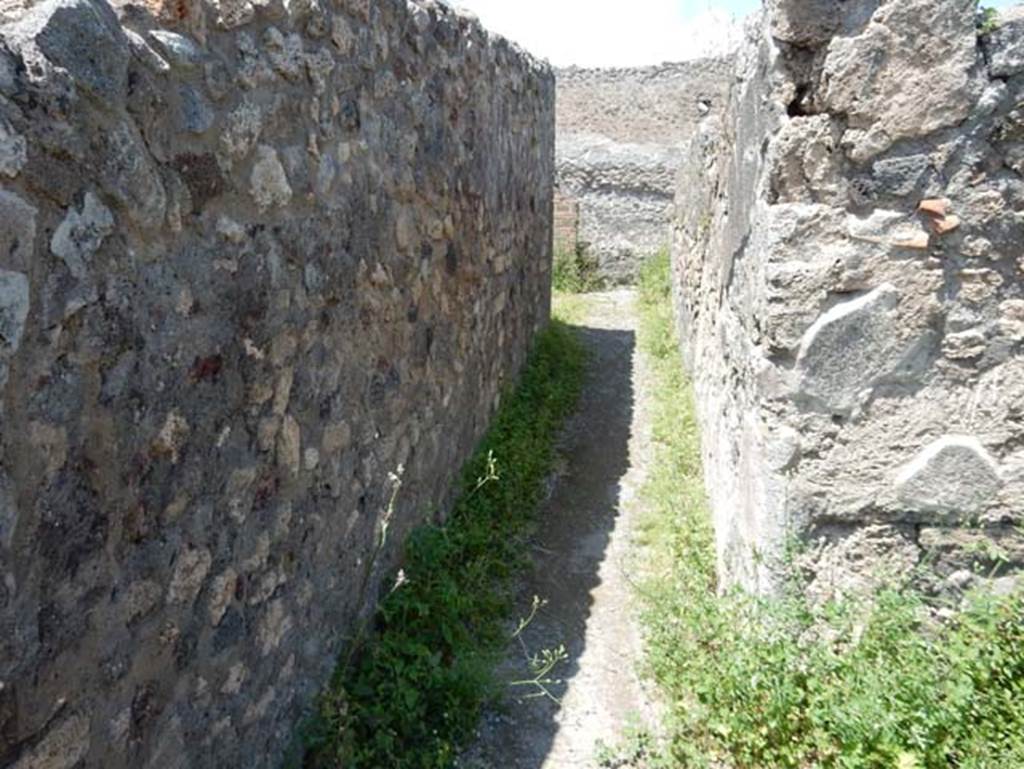 VIII.2.3 Pompeii. May 2018. Passageway turning to north and leading to VIII.2.4. Photo courtesy of Buzz Ferebee.