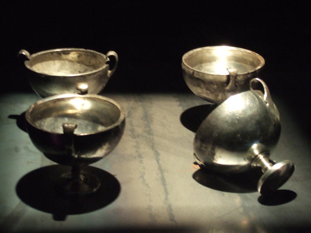 Four silver kantharos or cups found 20th September 1887 in VIII.2.23. 
Now in Naples Archaeological Museum.  Inventory numbers 116329, 116330, 116331 and 116332.
See Guzzo, P. (A cura di), 2006. Argenti a Pompei. Milano, Electa. (pp. 130-4).
