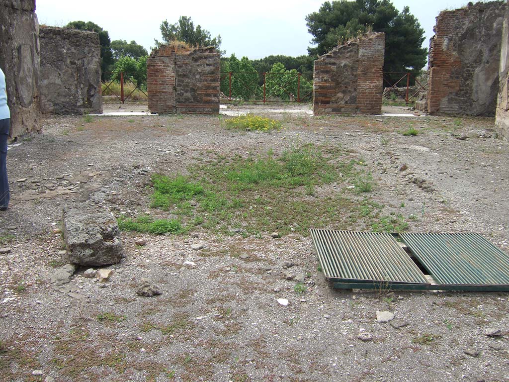 VIII.2.34 Pompeii. May 2006. Cistern mouth on north side, near impluvium in atrium.