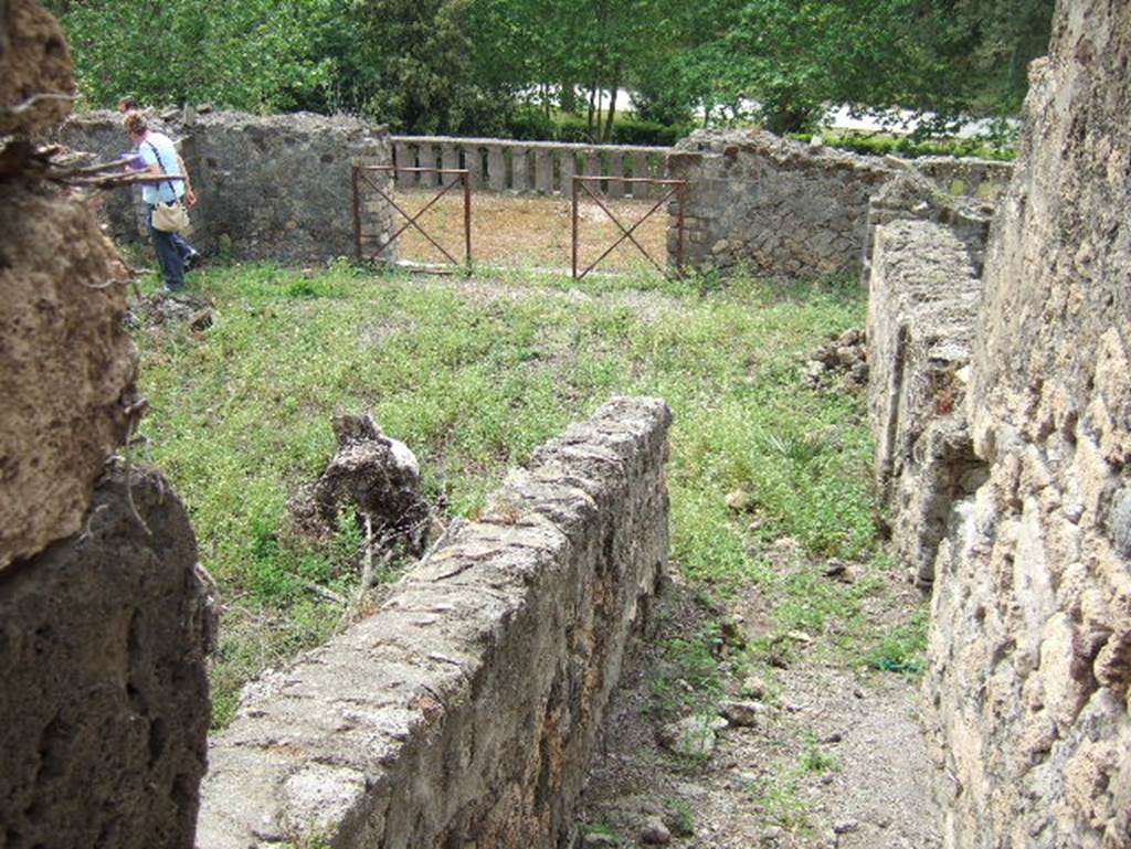 VIII.2.34 Pompeii. May 2006. Looking south across ramp or steps of passagway ‘7’ towards site of three triclinia, leading onto the lower terrace.
