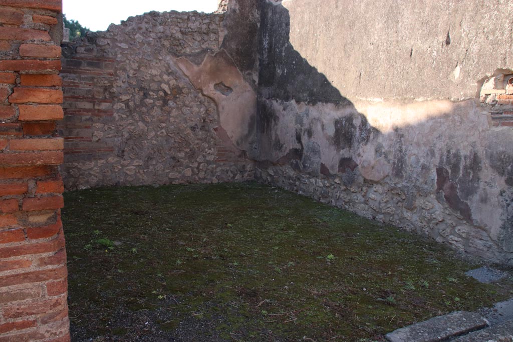 VIII.3.9 Pompeii. October 2022. Looking south-west across shop-room. Photo courtesy of Klaus Heese. 
On the south wall the outline of the stairs to the upper floor can still be recognised.
On the west wall a high zoccolo of cocciopesto can be seen.
