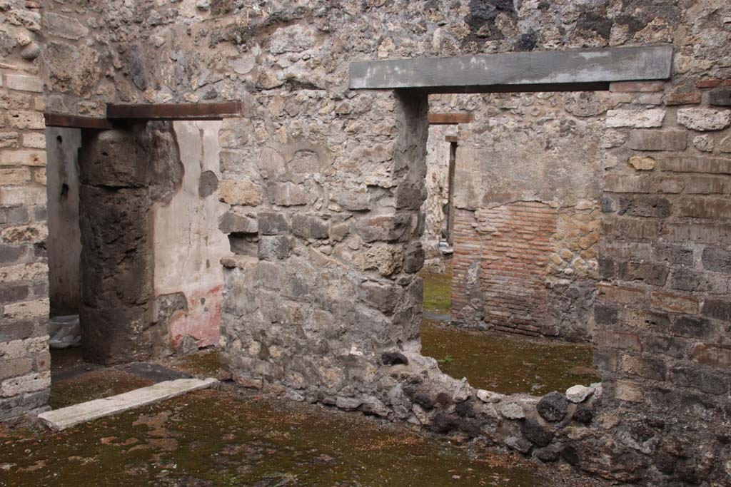 VIII.3.12 Pompeii. October 2020. Doorways on north side of entrance yard/courtyard
On the left, the doorway leading to a corridor leading to VIII.3.11 and doorway to triclinium. Photo courtesy of Klaus Heese.
