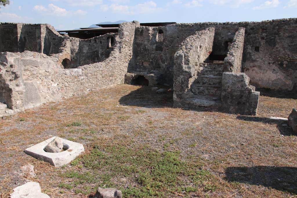 VIII.3.18 Pompeii. September 2021. 
Looking towards south-east corner of atrium (or right ala) with kitchen area, (together with kitchen area of peristyle in VIII.3.16, on left of it).
Photo courtesy of Klaus Heese.

