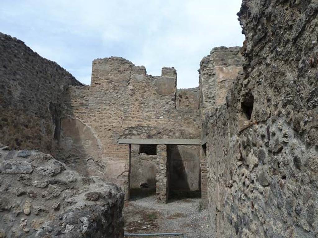 VIII.4.37 Pompeii. September 2015. Looking north from entrance corridor into central courtyard with two doorways in its north wall, and doorway to corridor in the east wall, on right. According to Eschebach, this room was either a small cavaedium (central courtyard) or a sitting room.
See Eschebach, L., 1993. Gebudeverzeichnis und Stadtplan der antiken Stadt Pompeji. Kln: Bhlau. (p.376-7)


