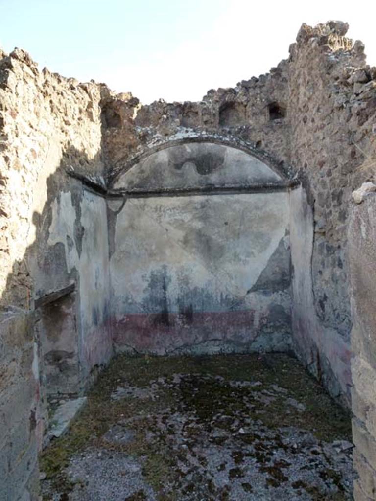 VIII.6.10 Pompeii. September 2011. Looking towards room  m, on south side of peristyle.
In the south-west corner of the peristyle were two bedrooms. According to BdI, room n with a window onto the western vicolo was perhaps the bedroom of a servant. The walls were crudely painted in the latest style with red zoccolo, and a white background. The floor was made of material similar to opus signinum, while part of the floor was composed of pieces of travertine.
In room m, the place of the bed was covered by a vaulted ceiling. The walls had a simple decoration: a dark-red zoccolo which ended at the top with a narrow green stripe, above this the walls were white. On top of the white walls was a white cornice which was under a narrow blue frieze.  There is no doubt that this decoration must be attributed to the time of the Third Style. A narrow door joined room m to the room that remained under the stairs at L by which you reached the upper floor. See BdI, 1884, p.184 
