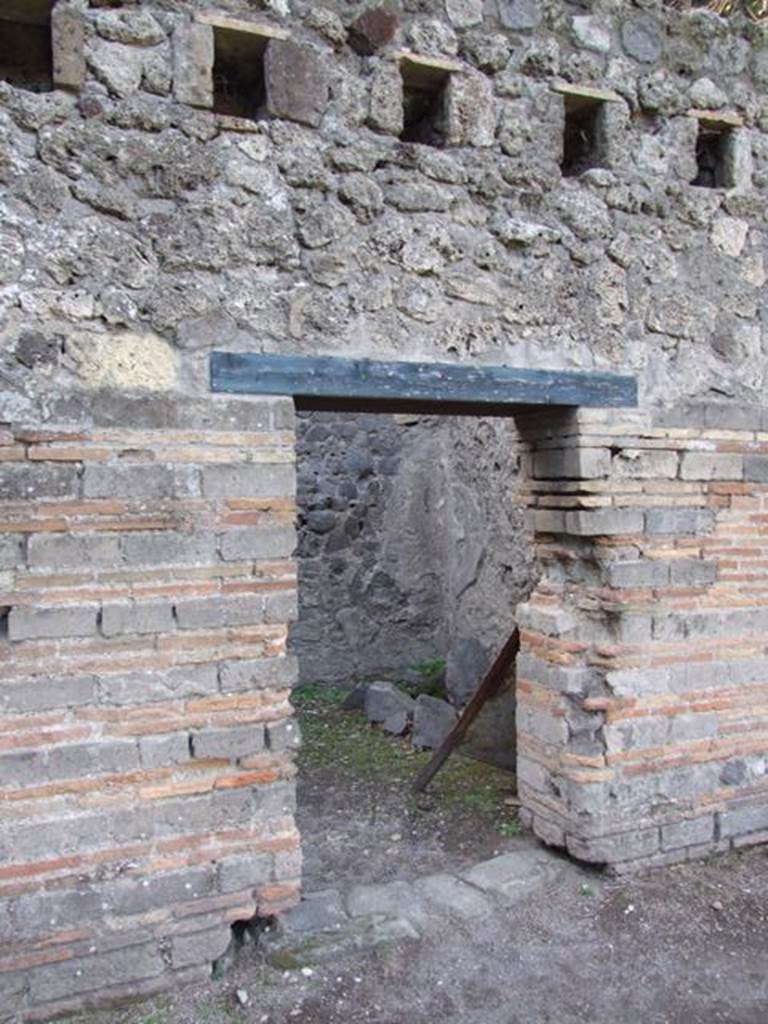 VIII.7.16 Pompeii.  December 2007. Room on west side.  Mau identifies this as a guard room.  A set of stocks for confining prisoners was found here.  
The skeletons of four persons who were not locked in the stocks at the time of the eruption were found here.  See Mau, A., 1907, translated by Kelsey F. W. Pompeii: Its Life and Art. New York: Macmillan. (p.163).
