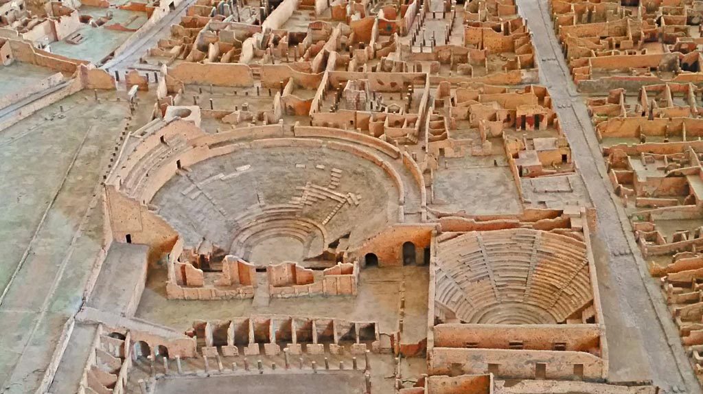 VIII.7.20 Pompeii. 2016/2017. 
Detail of Large Theatre, Little Theatre and other areas of VIII.7, from model in Naples Archaeological Museum. 
Photo courtesy of Giuseppe Ciaramella 
This entrance also provided access to the two rear entrances to the Little Theatre or Odeon.
For more details of the Large Theatre:
See Mau, A., 1907, translated by Kelsey F. W. Pompeii: Its Life and Art. New York: Macmillan. pages 141-152.
