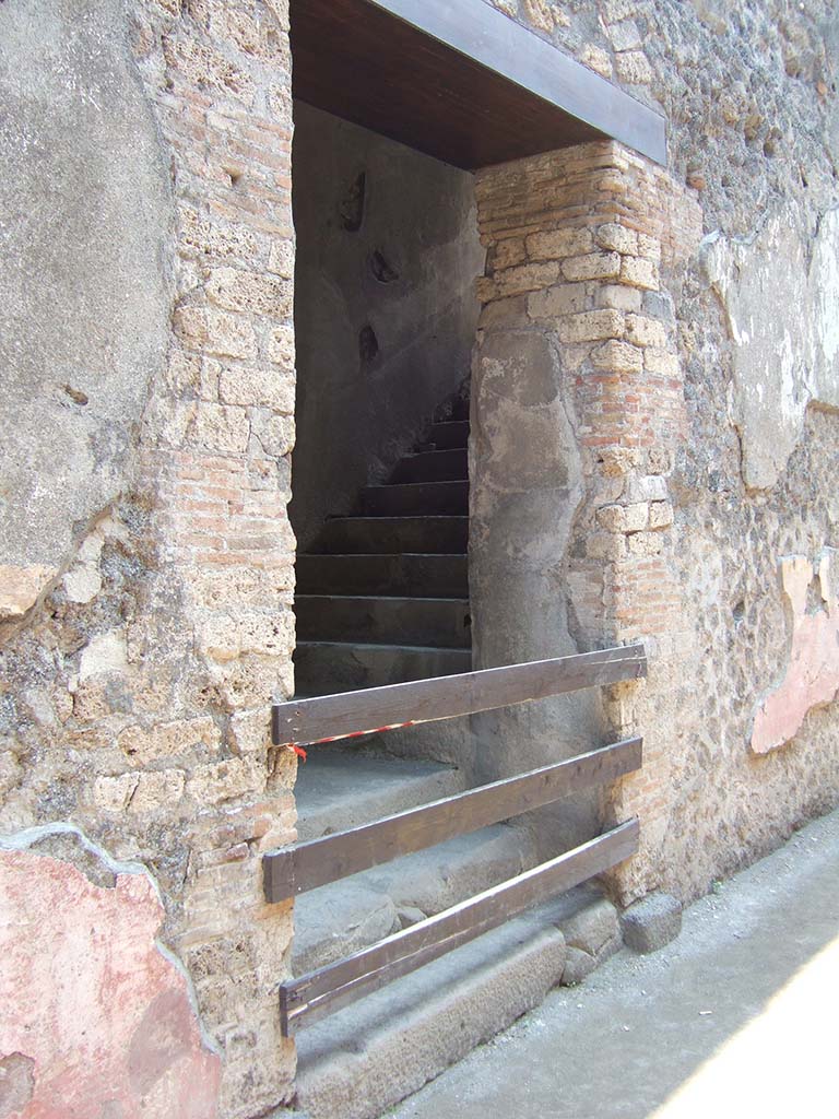 VIII.7.20 Pompeii. May 2006. South wall. 
First, east rear entrance to the Little Theatre or Odeon with steps to upper seating.

