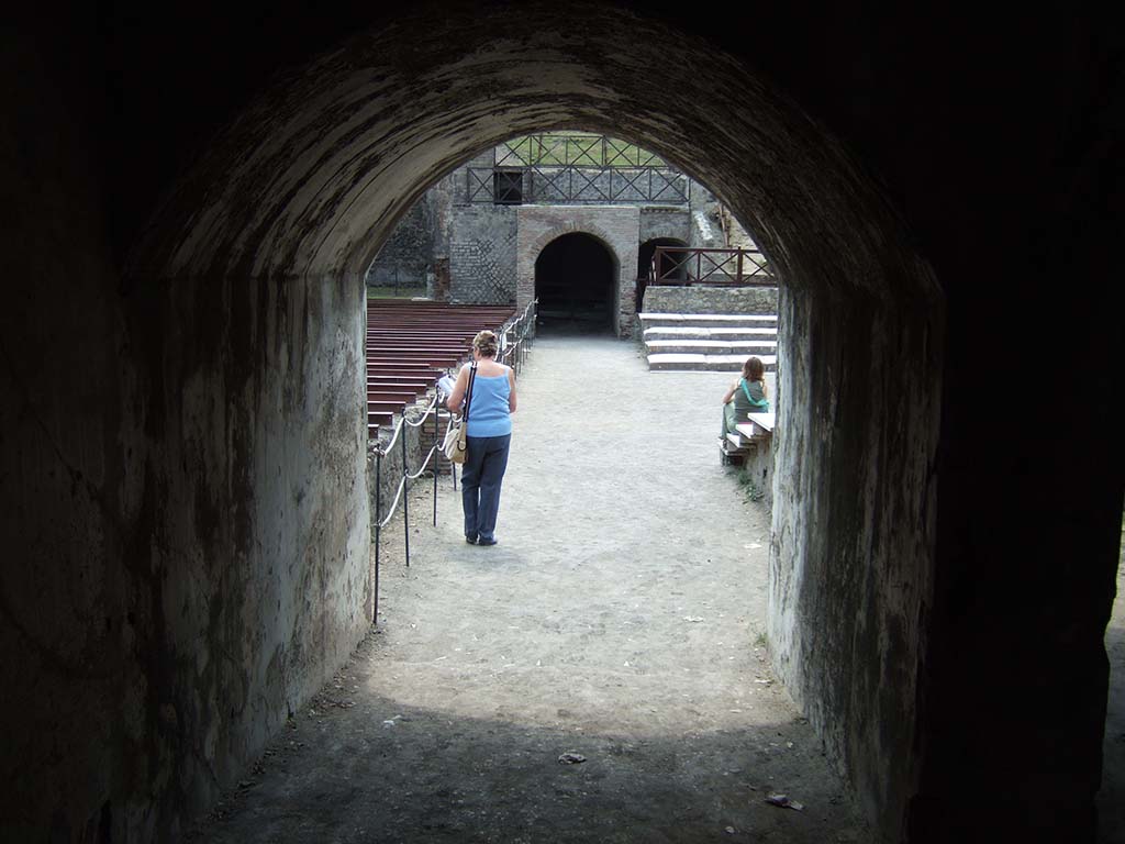 VIII.7.20 Pompeii. May 2006. Looking across the theatre to the arch over which is the tribunal.