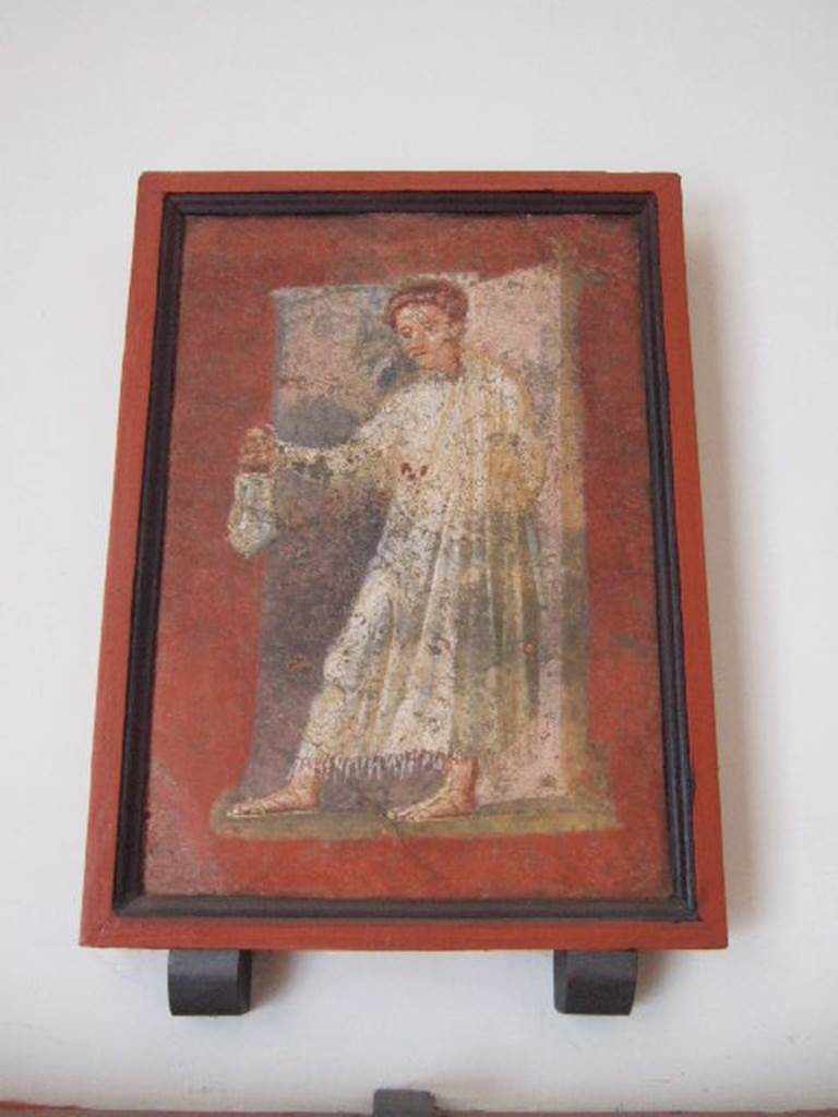 VIII.7.28 Pompeii.   “Priest bearing a situla or bucket”.  Found in panel on right part of south wall.  Now in Naples Archaeological Museum.

