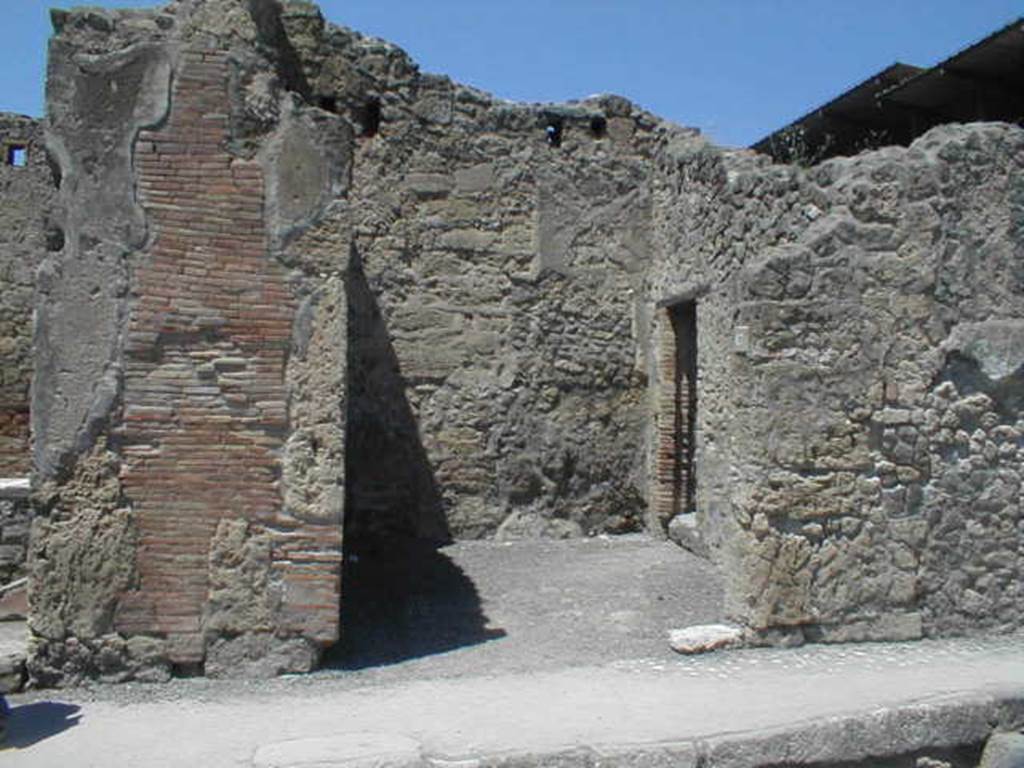 IX.1.17 Pompeii. May 2005. Entrance on Via dellAbbondanza. Looking north. The doorway in the east wall, on the right, leads into IX.1.18. For graffiti found on the left pilaster, between IX.1.16 and 17, see IX.1.16.  The following graffiti was found in March 1858, on the pilaster between IX.1.17and IX.1.18 (on the right)

C(aium)  Vestorium   [CIL IV 1051]

Lollium
aed(ilem)  o(ro)  v(os)  f(aciatis) d(ignum)  r(ei)  p(ublicae)   [CIL IV 1052]

Polybium
II vir(um)  Lollia
cum  suis    [CIL IV 1053]

Priscum  [CIL IV 1054]

L(ucium)  Ceium  Firmum  o(ro)  v(os)  f(aciatis)  d(ignum)  r(ei)  p(ublicae)   [CIL IV 1055]

See Pagano, M. and Prisciandaro, R., 2006. Studio sulle provenienze degli oggetti rinvenuti negli scavi borbonici del regno di Napoli..  Naples : Nicola Longobardi. (p.175) 
