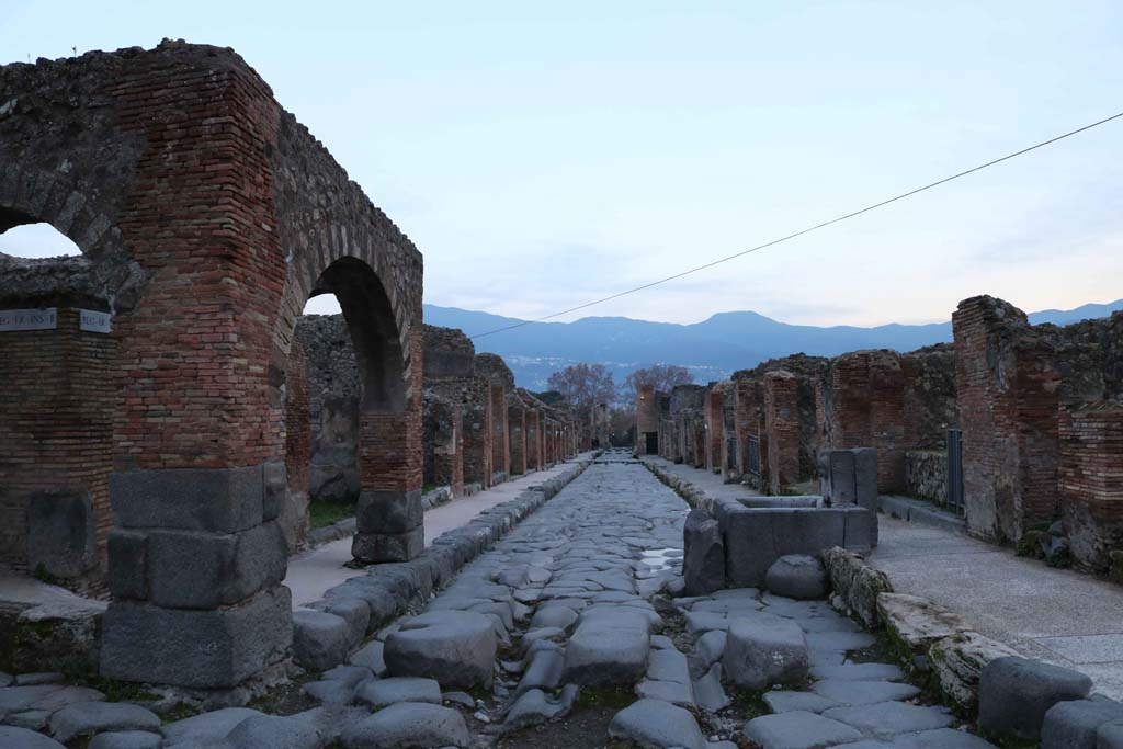 IX.2.1 Pompeii, on left. December 2018. Looking south on Via Stabiana, between IX.2 and VII.1. Photo courtesy of Aude Durand.