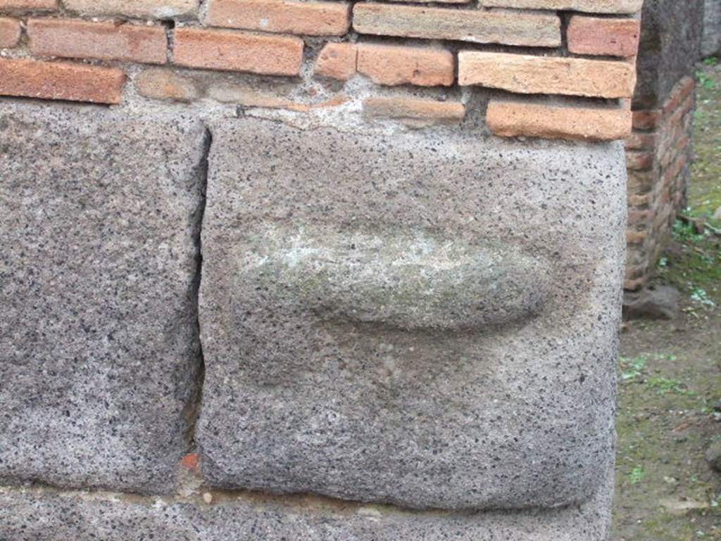 IX.2.1 Pompeii. December 2005. Phallus carved out of lavastone, on arcade pillar.