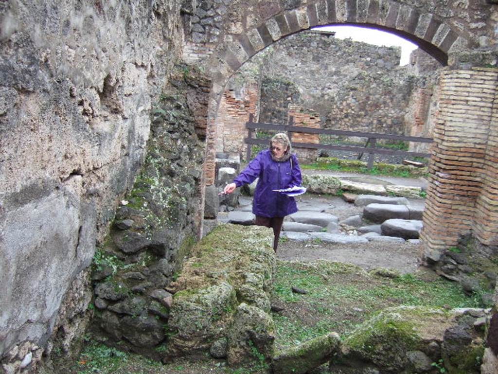 IX.2.1 Pompeii. December 2005. Street altar with Lares Compitales on south wall.