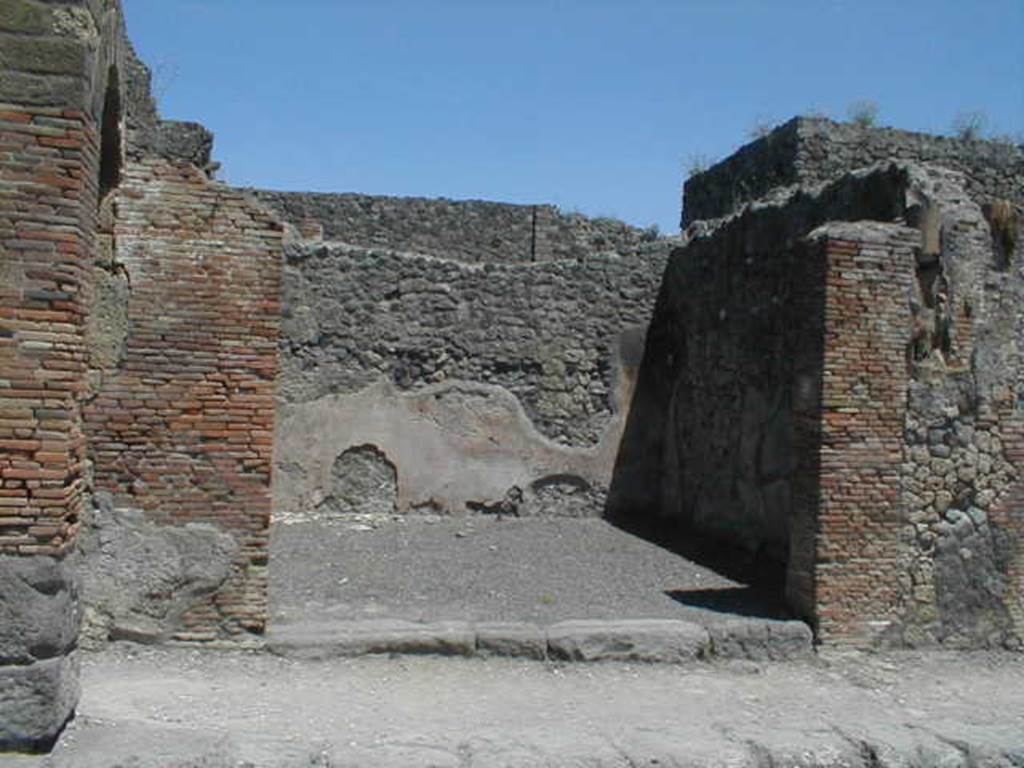 IX.2.2 Pompeii. May 2005. Entrance, looking east from Via Stabiana. On the right of the entrance can be seen a downpipe from the upper floor.
