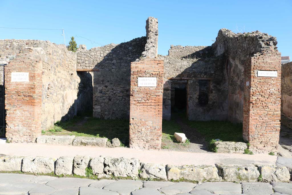 IX.2.11, on left, and IX.2.12, on right. December 2018. Looking east to entrance doorways. Photo courtesy of Aude Durand.
