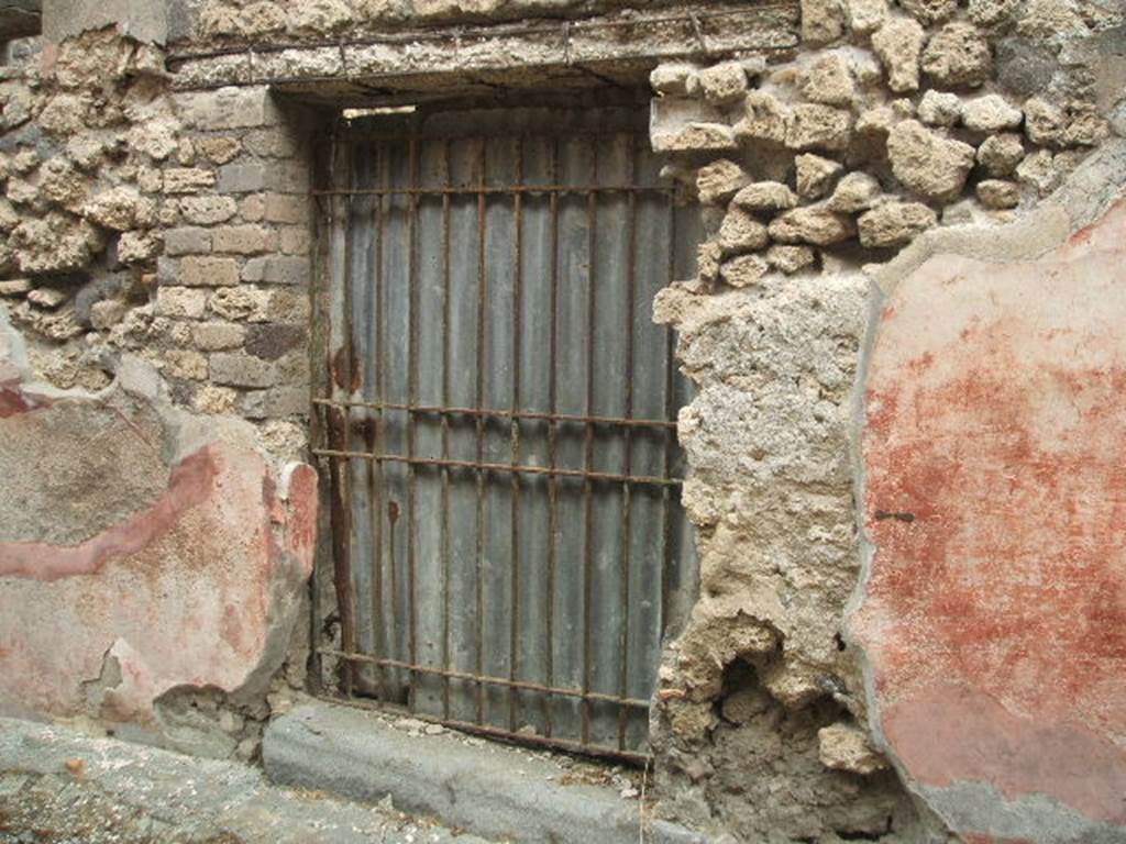 IX.2.15 Pompeii. May 2005. Entrance on Vicolo di Balbo. According to Fiorelli, somewhere near this doorway, between IX.2.15 and IX.2.16, the following graffiti was found:

CN . HELVIVM . SABINVM . AED . BALBVS . FECIT    [CIL IV 935d]

A . VETTIVM . CAPRASIVM . FELICEM . AED . D . R . P . OVF    

A . VETTIVM . CAPRASIVM
                   FELICEM . AED . BALBE . ROGAMVS    [CIL IV 935i]

apart from many other names, also found was the graffito:

AMPLIATII
INVICTII  VALE    [CIL IV 2355]

See Pappalardo, U., 2001. La Descrizione di Pompei per Giuseppe Fiorelli (1875). Napoli: Massa Editore. (p. 142)

