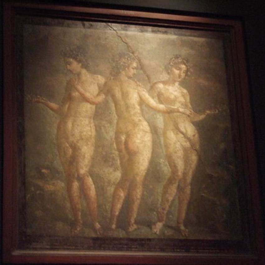Painting of the Three Graces. Found on south wall of tablinum of IX.2.16. 
Now in Naples Archaeological Museum.  Inventory number 9236.

