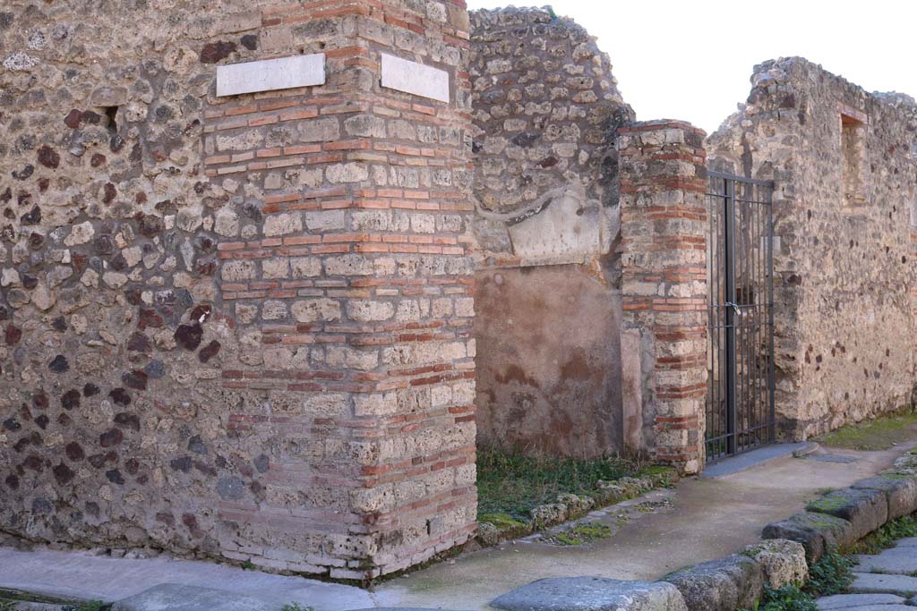IX.2.20 Pompeii. December 2018. 
Looking west to entrance doorway, in centre, with doorway to IX.2.21, centre right. Photo courtesy of Aude Durand.

