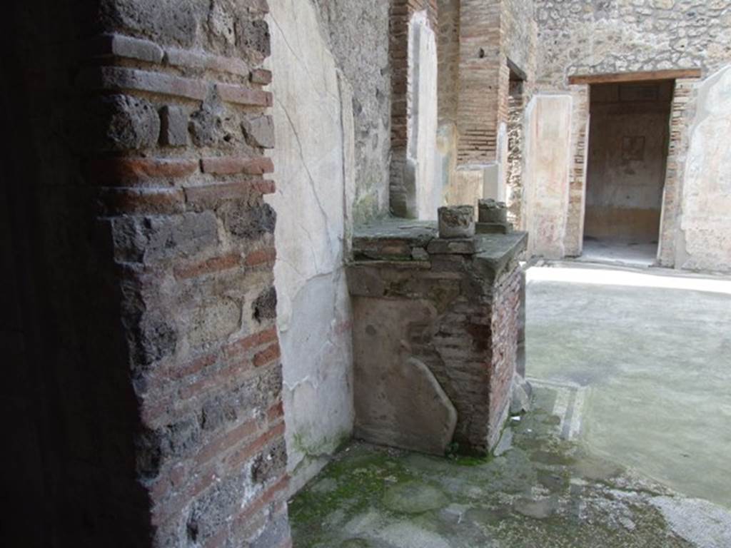 IX.3.5 Pompeii. March 2009. Room 3, remains of aedicula altar on south-west side of atrium, looking north from room 16.