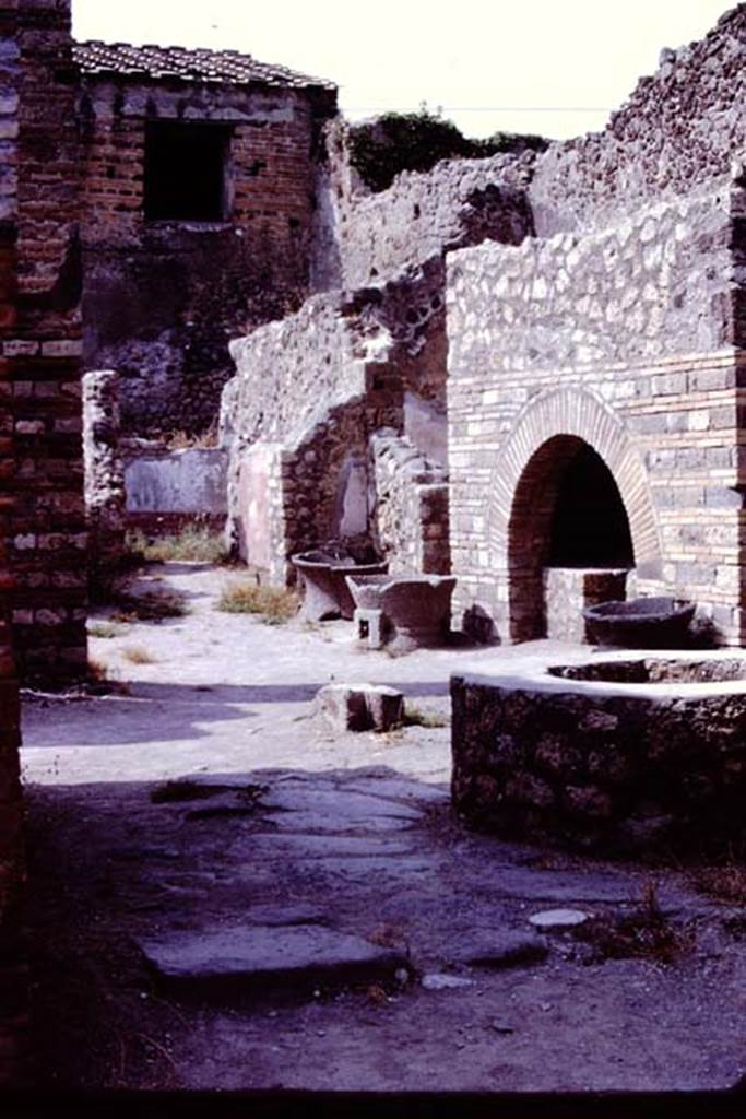 IX.3.12 Pompeii. 1966. Looking north-east across bakery from entrance doorway.  Photo by Stanley A. Jashemski.
Source: The Wilhelmina and Stanley A. Jashemski archive in the University of Maryland Library, Special Collections (See collection page) and made available under the Creative Commons Attribution-Non Commercial License v.4. See Licence and use details.
J66f0130
